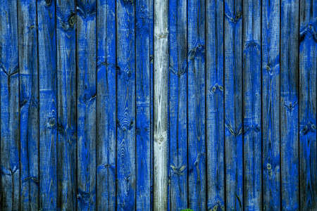 Blue weathered wall from wooden planks with paint tracesの写真素材