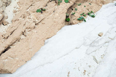 Textured detail showing white sand and beige clayの写真素材