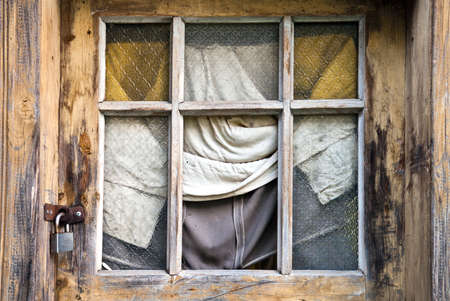 Window of an authentic wooden country house with lockの写真素材