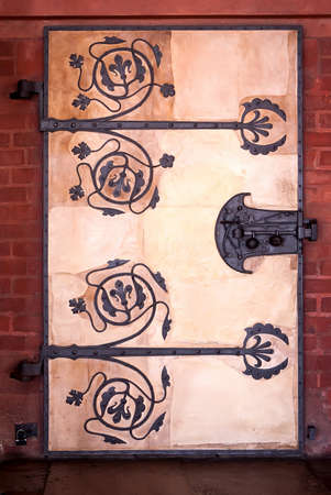 Old wooden door in a brick wallの写真素材