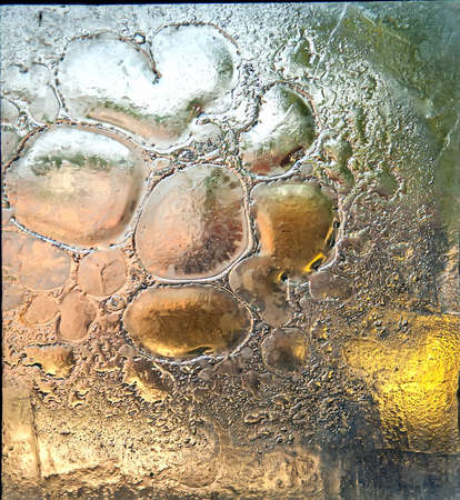 Antique glass window and a blurred landscape on the backgroundの写真素材
