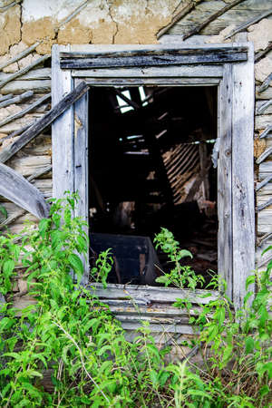 Abandoned rustic house with wooden windowの写真素材