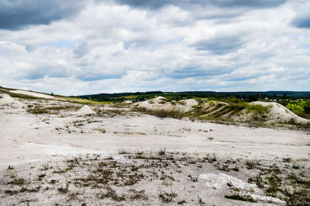 Quarry for the extraction of sand and a beautiful sky in the clouds above itの写真素材