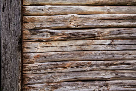 Wooden wall from logs as a background textureの写真素材