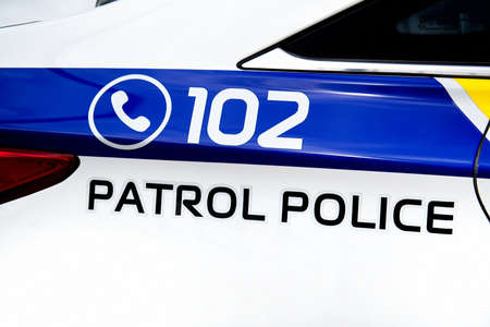 Closeup of the body of the police car with a sign patrol policeの写真素材
