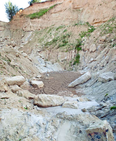 The cracks on the parched earth at the bottom of the dried-up lakeの写真素材