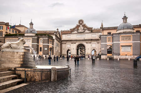 Rome, Italy - October 31, 2012: The main entrance of Piazza del Popolo - Porta del Popolo gate. Piazza del Popolo is a large urban square in Rome, that many locals and tourists passing by everyday.のeditorial素材