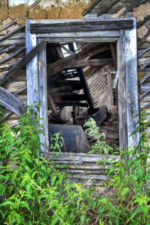 Abandoned rustic house with wooden windowの写真素材