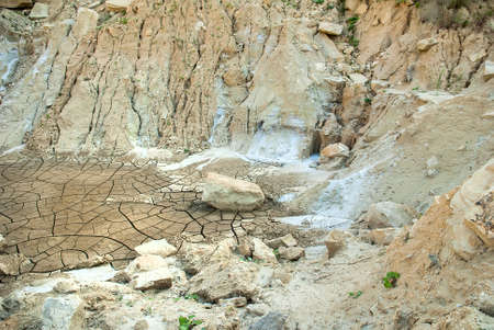 Cracks on the parched earth at the bottom of the dried-up lakeの写真素材