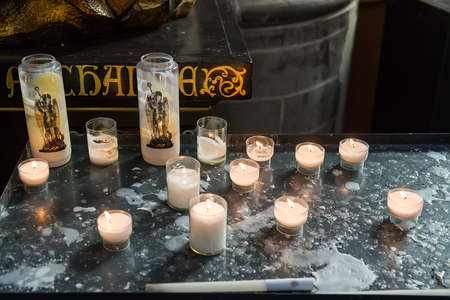 Burning candles in the catholic churchの写真素材