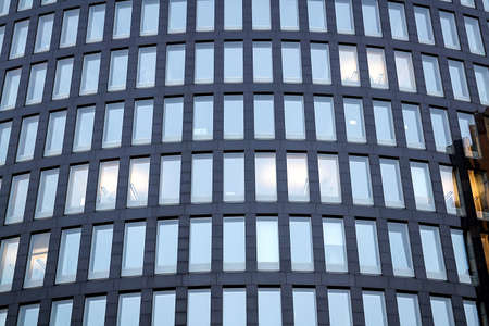 Backgrounds of modern architecture with mirror window reflectionの写真素材