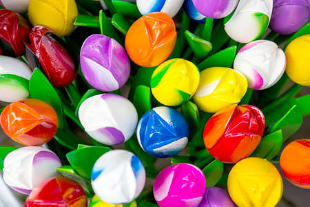 Colorful plastic decorative artificial tulips, close-up, backgroundの写真素材