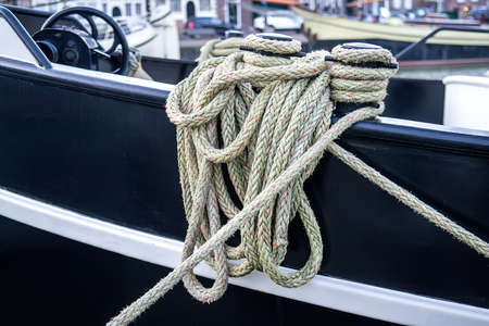 Rope tied in a knot on a bollardの写真素材
