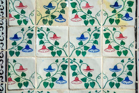 Detail of the traditional tiles from facade of old house. Decorative tiles.Spain traditional tiles. Floral ornament.の写真素材