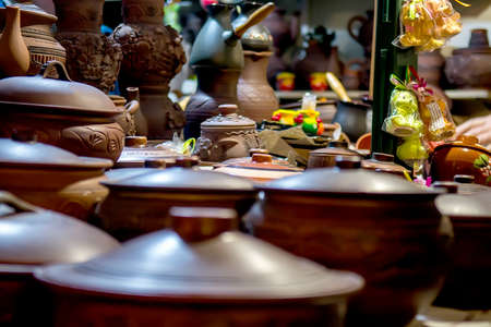 Clay pots stacked for sale on a Christmas market. Selective focusの写真素材