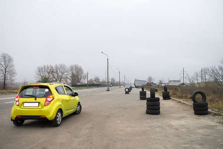 Modern car and safety tires in driving school outdoorsの写真素材