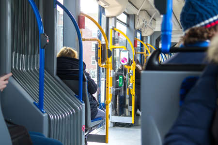 People inside the tram wagon. Selective focusの写真素材