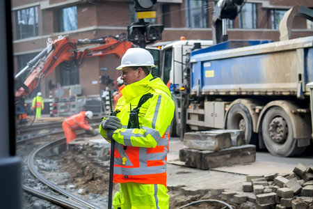 Amsterdam, Netherlands - February 9, 2018: Construction site and workers repairing tram lines....