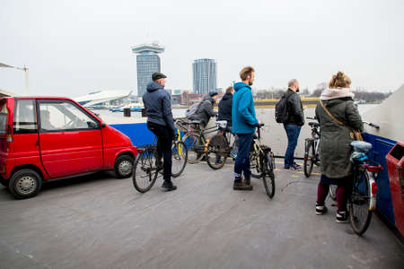 Amsterdam, Netherlands - February 9, 2018: passengers and vehicle ferry traveling across the sea. Selective focusのeditorial素材