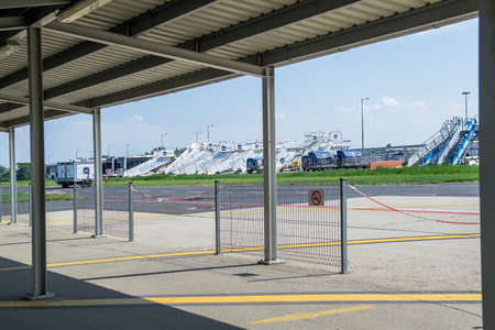 Budapest, Hungary - Aug 3, 2018: Movable passenger's boarding ramps standing on the airfieldのeditorial素材