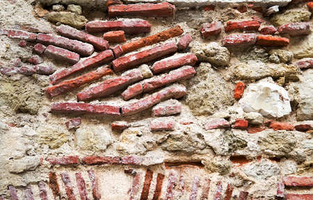 The texture of an ancient destroyed stone wallの写真素材