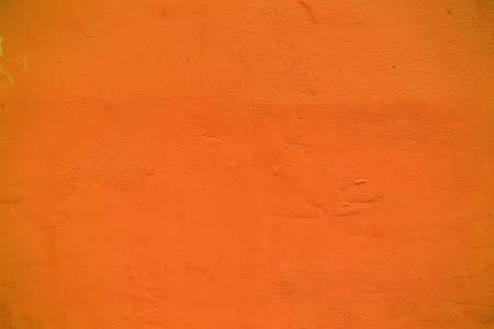 Orange grunge cement wall, textured backgroundの写真素材
