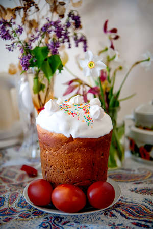 Spring Easter cake withsugar decor, on a background of spring flowers. Selective focusの写真素材