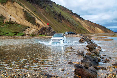 Car fording river in Landmannalaugar, Icelandの写真素材