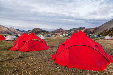 Camping tents in the mountains, tents and clothing line with volcanic mountain background, Landmannalaugar, Icelandの写真素材