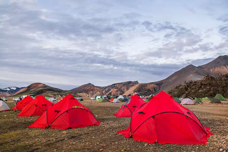 Camping tents in the mountains, tents and clothing line with volcanic mountain background, Landmannalaugar, Icelandの写真素材