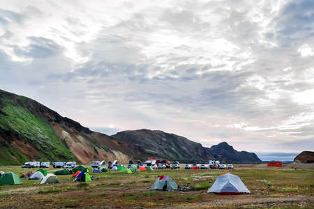Camping tents in the mountains, tents and clothing line with volcanic mountain background, Landmannalaugar, Icelandの写真素材