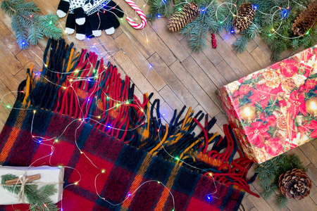 Colourful Christmas New Year holiday background with blanket and grunge wood textureの写真素材