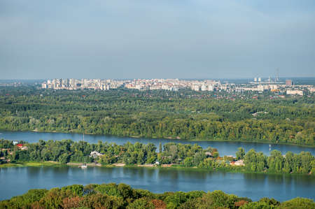 Autumn sunny hot day. Residential areas on hills in Kyiv on the left bank of the Dnieper River. Kyiv. Ukraine.の写真素材