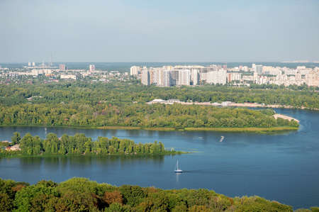 Autumn sunny hot day. Residential areas on hills in Kyiv on the left bank of the Dnieper River. Kyiv. Ukraine.の写真素材