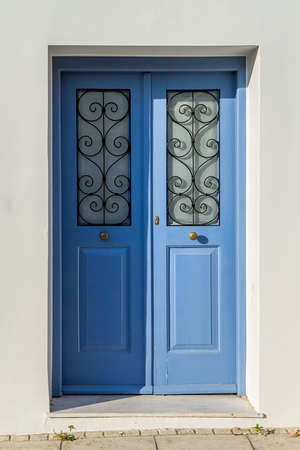 Old wooden door of an mediterranean house, vintage background.の写真素材