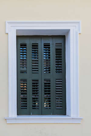 Old wooden window shutters of an mediterranean house, vintage background.の写真素材