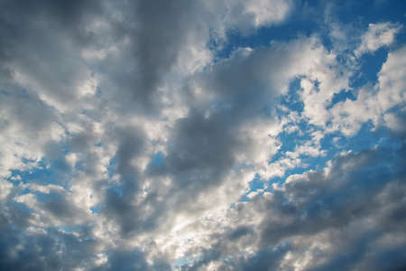Blue sky background with cloudsの写真素材