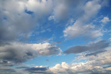 Blue sky background with cloudsの写真素材