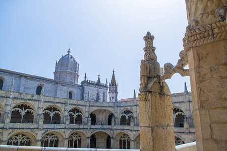 Portugal, Lisbon - 05 Aug 2018: Panoramic view of Jeronimos Monastery cloister courtyard with ornate Manueline arches, upper galleries, central dome and tourists on the same day as previous cloisterのeditorial素材