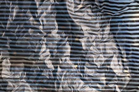Crumpled old recycled blank empty black stripes paper background. Eco-friendly design, eco-friendly...