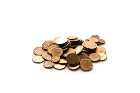 A small pile of Russian ruble coins isolated on a white background. The concept of falling, debt, poverty.の写真素材