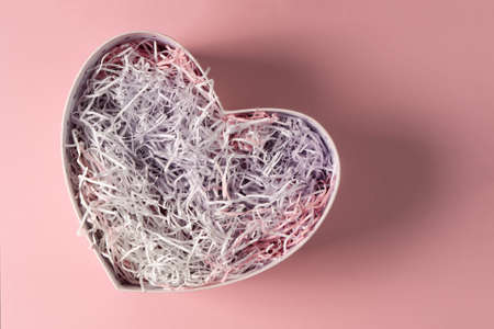 Heart-shaped gift box on a pink background . Mockup for your product . Great design for advertising, holiday, greeting card.の写真素材