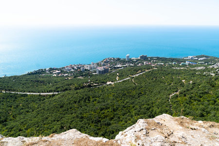 View of the panorama of the beach and the black sea in the background down. Ai-Petri, Crimea. Pine...