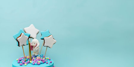 A delightful dessert arrangement showcases a playful cake adorned with colorful candies and star-shaped decorations. The cheerful atmosphere radiates joy, perfect for any celebration.Copy space.の写真素材