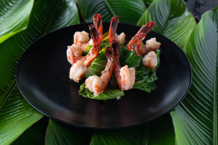 Tiger prawns are elegantly arranged on a bed of lush banana leaves, highlighting the vibrant colors and textures that embody the essence of Asian cuisine. A delightful feast awaits.の写真素材