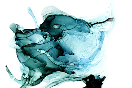 A stunning display of colored alcohol ink unfolds in swirling patterns, showcasing a blend of deep greens and blues.の写真素材