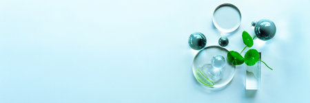 Arrangement features aloe and centella with clear serum droplets, ideal for spa. Banner for your textの写真素材