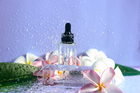Hydrating serum sits gracefully on an ice cube surrounded by plumeria flowers and water droplets.