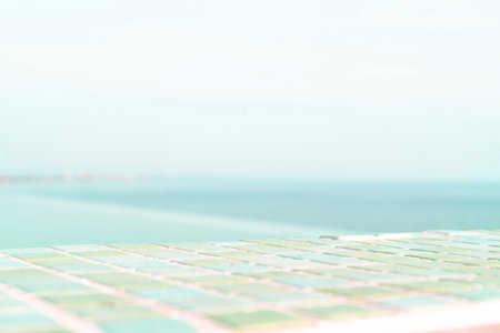 Indulge in a day of relaxation at a gorgeous spa, overlooking the stunning blue sea. Horizontal. The perfect template for advertising your product on the edge of a pool and sky.の写真素材