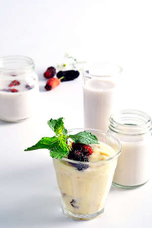 Mulberry yogurt in a glassの写真素材